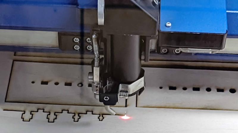 Epilog Laser cutter cutting plywood